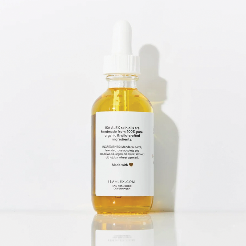 Bottle of Isa Alex Beautiful body oil on a white background