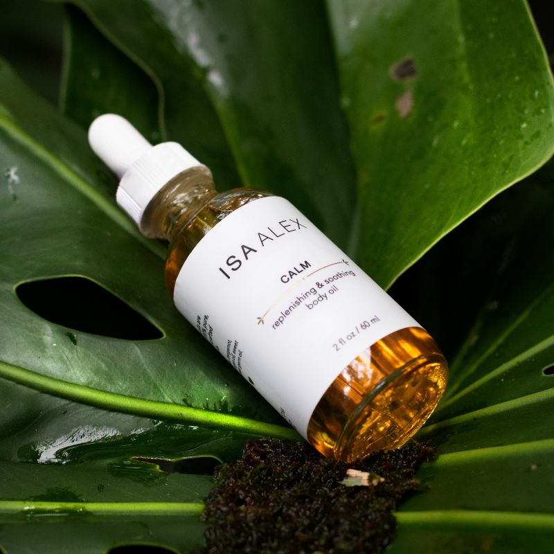 Isa Alex Calm oil bottle on a leaf