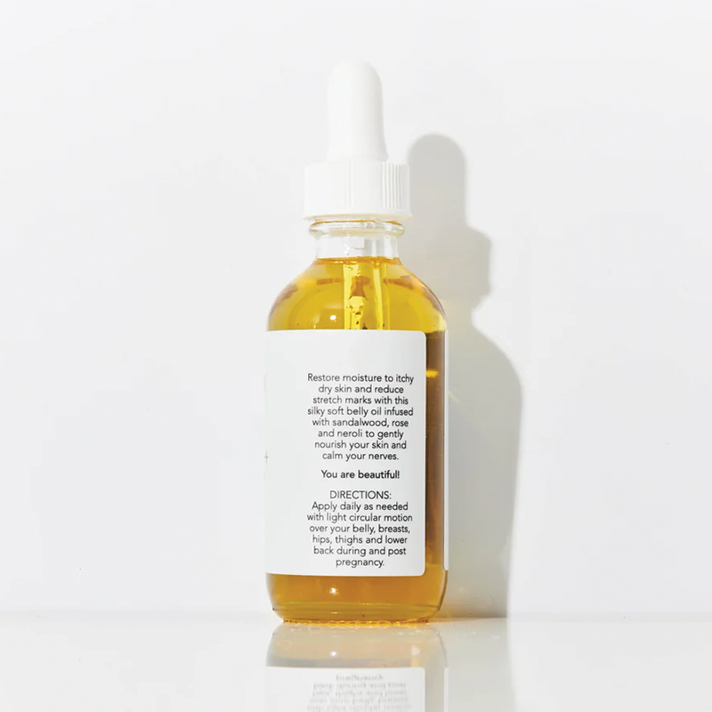 Bottle of Isa Alex Beautiful body oil on a white background