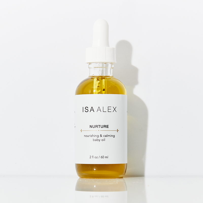 ISA ALEX Nurture baby oil bottle with dropper on a white background